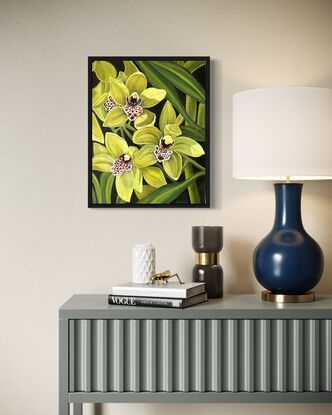 Three green orchid flowers with Maroon and white centres and dark background 