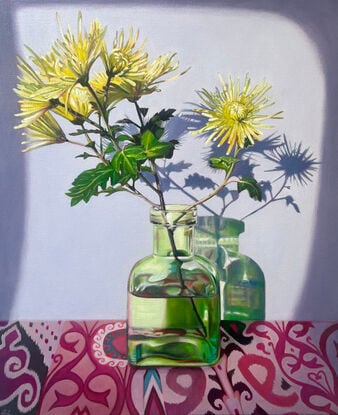 Chrysanthemums in green vase on patterns.