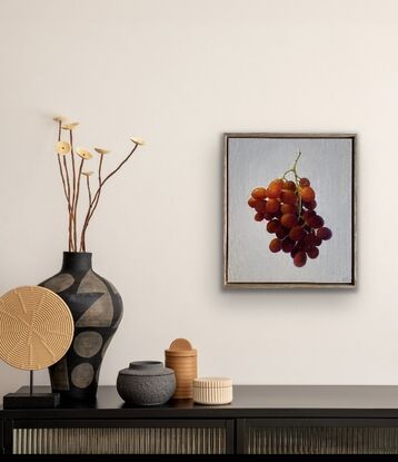 Framed in a Tasmanian Oak frame and painted in professional oil paints on linen.  The artwork shows the beautiful glow that grapes give in the summer. 