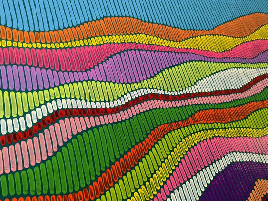 Abstract bright and colourful fields and hills of wild flowers covering a landscape of hills and valleys.