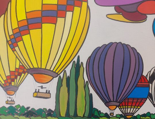 Hot air balloons embarking through the sky. 