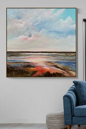 Colourful Textured abstract landscape with fluffy vibrant hot pink  white and blue fluffy clouds above a sunset filled landscape with blue water flowing through.