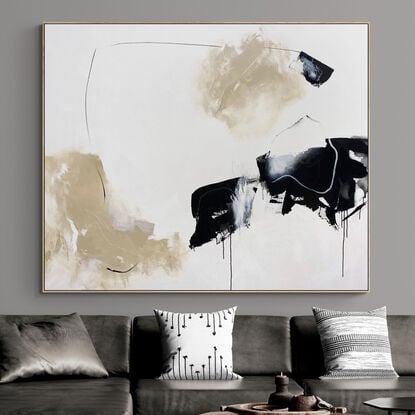 bold marks in beige and black across the canvas suggestive of open spaces made from large expressive marks with pops of white across the canvas