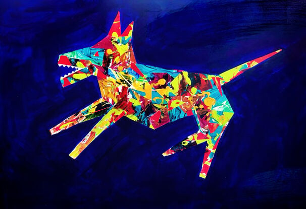 Multi-coloured dog on dark blue background.