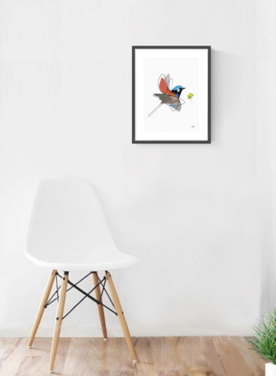 Multi coloured fairywren bird in flight with  tree leaves