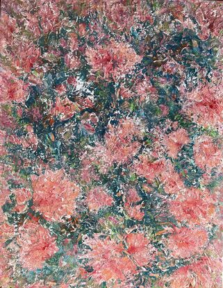 Pink and coral coloured flowers stand out predominantly over a blue and green background 