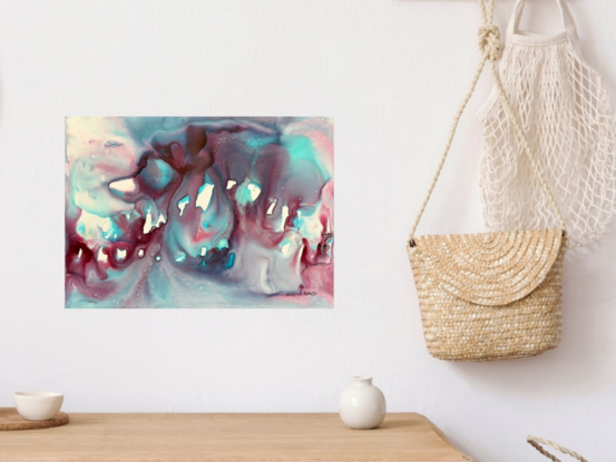 This mesmerizing mixed media abstract artwork, titled 'Veil,' evokes a sense of mystery and fluidity with its rich blend of turquoise and deep burgundy hues. The organic forms and translucent layers seem to dance and shift, reminiscent of an underwater dreamscape or ethereal figures shrouded in mist. The dynamic interplay of light and shadow invites viewers to explore the depths of imagination, allowing each to find their own story within the abstract composition. A perfect piece for those who appreciate art that blends fluidity with a touch of the surreal.
