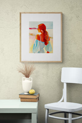 Introducing 'Reverie,' a captivating watercolour artwork that beautifully captures a serene moment of quiet contemplation. The painting features a woman with flowing auburn hair, bathed in soft light, gazing thoughtfully into the distance. The delicate interplay of cool blues and warm reds creates a harmonious contrast, while the soft brushstrokes evoke a sense of gentle breeze and tranquility. 'Reverie' is a celebration of peaceful introspection, making it a perfect addition to spaces that embrace calm and elegance.