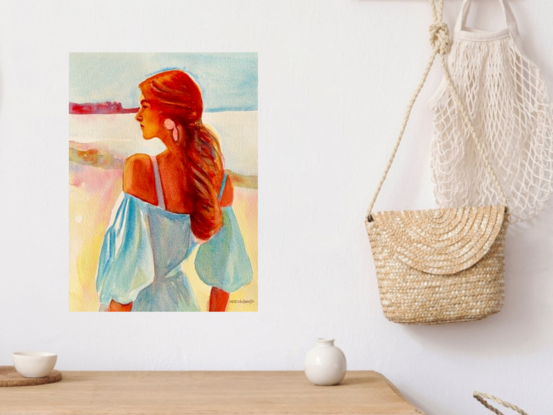 Introducing 'Reverie,' a captivating watercolour artwork that beautifully captures a serene moment of quiet contemplation. The painting features a woman with flowing auburn hair, bathed in soft light, gazing thoughtfully into the distance. The delicate interplay of cool blues and warm reds creates a harmonious contrast, while the soft brushstrokes evoke a sense of gentle breeze and tranquility. 'Reverie' is a celebration of peaceful introspection, making it a perfect addition to spaces that embrace calm and elegance.