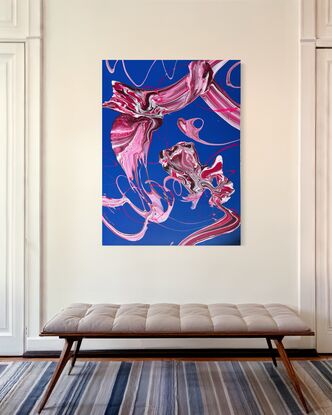 An abstract acrylic fluid art painting titled Blushing Whirlwind by Laura Anderson. The artwork features vibrant hues of pink, fuchsia, and crimson, swirling in dynamic patterns across a deep blue background. The texture is enhanced by an aerosol acrylic base, creating layers of movement and depth. The forms resemble wind currents or flowing ribbons, evoking a sense of fluidity and balance amidst the vibrant chaos.