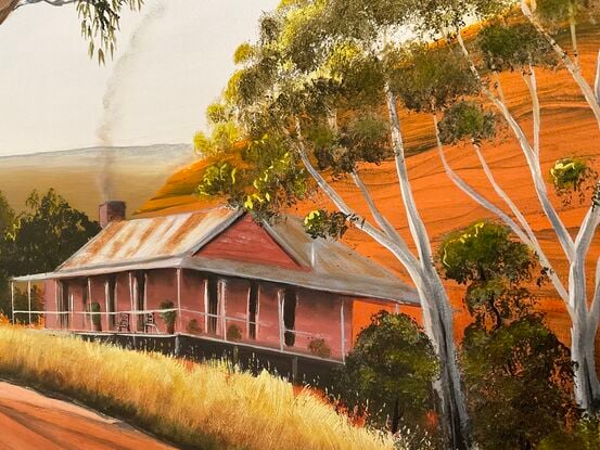 Australian Outback House on the Hill next to dirt road and large gumtree 