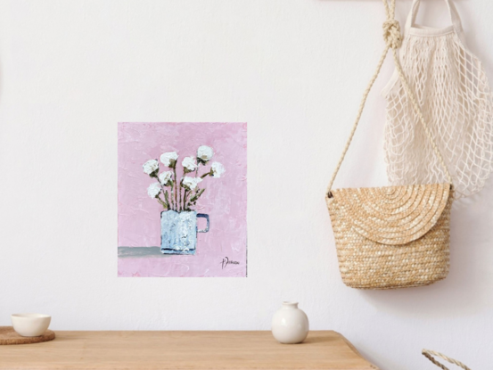 Still Life white flowers in blue vase with a pink  background.