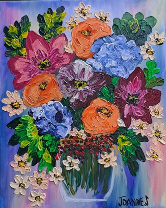 Orange pink blue flowers in a vase