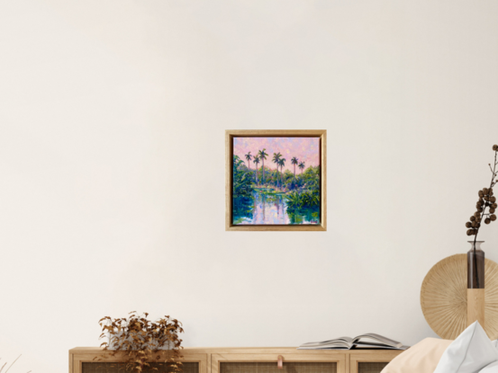 Pink sunset and palms reflecting in water