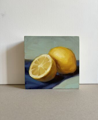 Original painting on wood. Two lemons on blue and green background. 