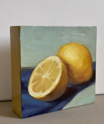 Original painting on wood. Two lemons on blue and green background. 