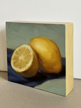 Original painting on wood. Two lemons on blue and green background. 