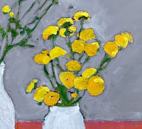 Yellow flowers in a white vase with orange table