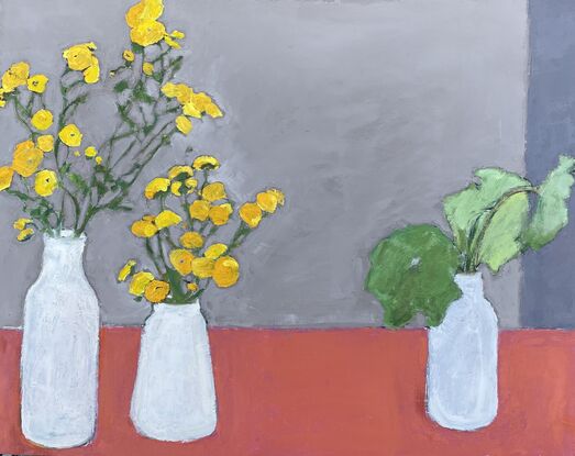 Yellow flowers in a white vase with orange table