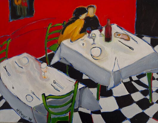 Couple sitting closely at romantic dinner