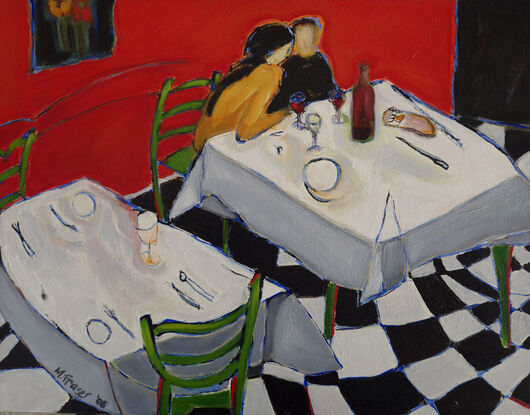 Couple sitting closely at romantic dinner