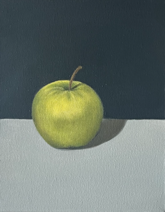 One green apple with grey background