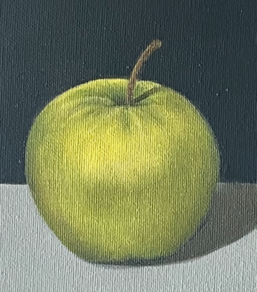 One green apple with grey background