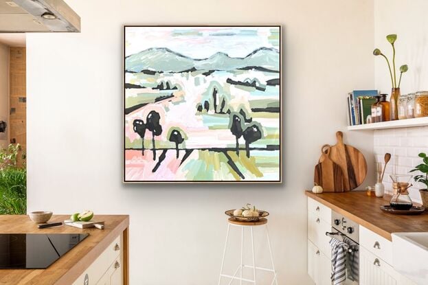 Large framed canvas with a textured landscape scene in pastel tones of orange, pinks, blues and greens. Abstract hills, trees and foliage shapes chunky paint with visible big brushstrokes.