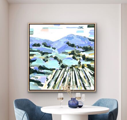 Large framed square canvas with a textured landscape scene in blues, purples, greens, mauves, lilac with lemon yellow and peach and apricot highlights. Abstract hills, trees and foliage shapes chunky paint with visible big brushstrokes.