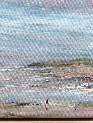 Woman standing alone on beach