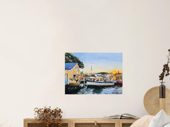 An old boatshed and boats at sunset