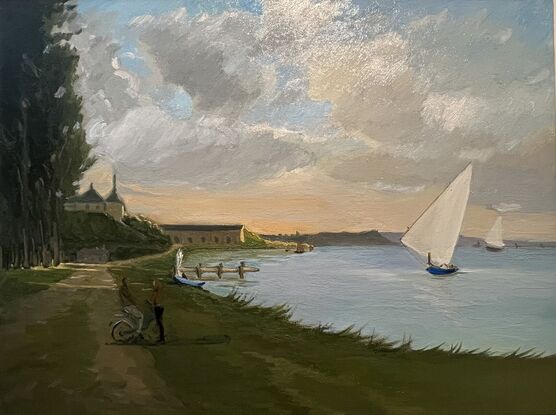 Shoreline at dusk with sailboats and a couple standing by the water