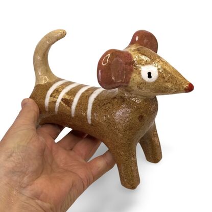 This stoneware sculpture features a stylised puppy.