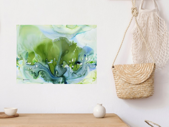 This captivating mixed media abstract artwork immerses the viewer in a world of vibrant greens and cool blues, evoking the serene essence of a lush landscape or an underwater scene. The fluid, organic forms and gentle gradients suggest a natural ebb and flow, inviting a sense of tranquility and wonder. Delicate white highlights punctuate the composition, adding a sense of movement and light that dances across the surface. Perfect for bringing a touch of nature's elegance into any space.