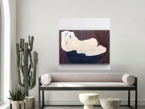 Nude woman reclining on navy blue sofa which has a crackle medium effect and maroon velvet curtains swathed across the background. 