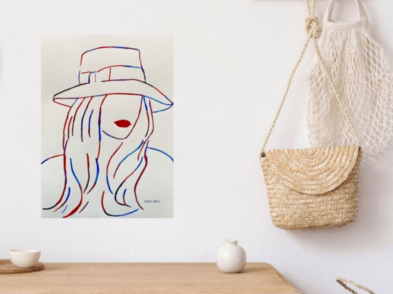 This striking watercolor artwork captures the essence of mystery and elegance through the use of bold, flowing lines in red and blue. The piece depicts a figure partially obscured by a wide-brimmed hat, with vivid red lips as the focal point, creating an enigmatic allure. The minimalist approach emphasizes the interplay between presence and absence, inviting the viewer to imagine the story behind the hidden visage. Perfect for art lovers drawn to simplicity and intrigue, this artwork speaks to the power of suggestion and the beauty of the unseen.
