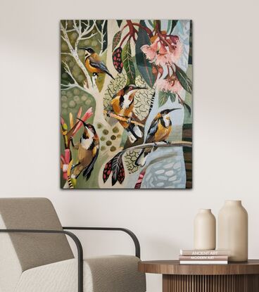 Perching Eastern Spinebill among pink gum blossom on an abstract background.