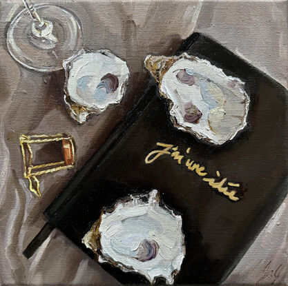 A still life table scape of oysters and wine