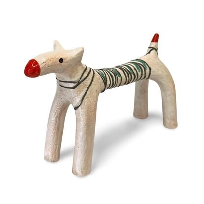 This ceramic sculpture features a dog-like figure with elongated legs and a stylised body. The body was wrapped in copper wire and fused into the white glaze. A few jade-coloured stripes highlight the oxidised copper.