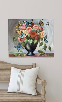 Butterfly Ball
Roses on the VIP List

This lively 50x60 cm piece bursts with character, showing a  black vase overflowing with vibrant roses, as large, colorful butterflies flutter around in all their glory. 

The rich, glossy acrylic brings out the vivid contrast of the flowers against the earthy brown table, while the grey background adds depth with its subtle circular illusion, drawing the viewer’s eye right into the action.

 It’s a whimsical blend of nature’s elegance and playful chaos—perfect for any space needing a dash of drama and charm.