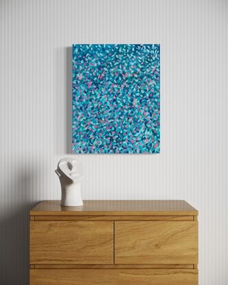 Colourful abstract art, petal shaped colours floating across a wood board 