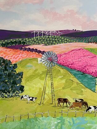 Cows grazing in brightly coloured pastures under a windmill.