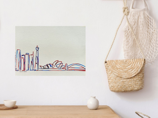 "Metropolis" is a contemporary watercolor artwork that elegantly captures the essence of Sydney’s cityscape through minimalist lines and vibrant hues of red and blue. This piece showcases the iconic Sydney Opera House, Harbour Bridge, and surrounding skyscrapers, all rendered in a linear and abstract style. The simplicity of the lines combined with the striking color palette brings a fresh and modern perspective to Sydney’s well-known landmarks, celebrating the city’s architectural charm.
