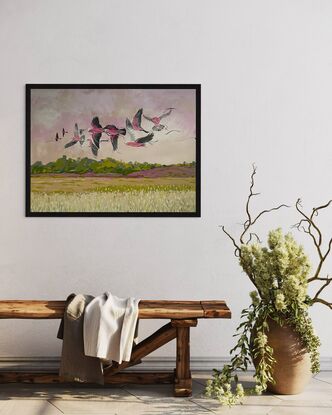 A flock of galahs flying across the landscape in the Central West NSW