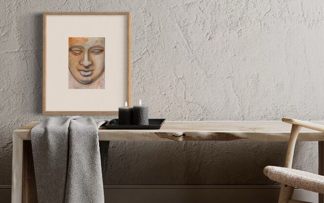 A serene image of a Buddhist statue, that achieves a feeling of inner glow.