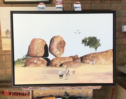 The Devils marbles (Karlu Karlu) with a swaggie and his three dogs deciding to camp.