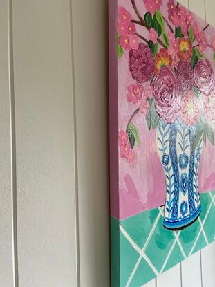 Large blue and white vase with big pink and red abstract flowers