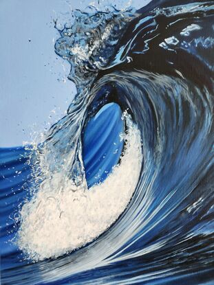 Crashing blue wave in the ocean.