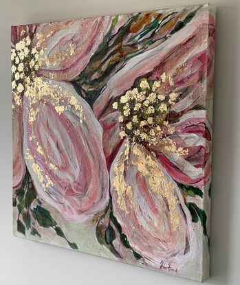 Dramatic and bright,  large textured soft pink and cream flowers with highlights of copious shiny gold leaf. Surrounded by green leaves, and completed with a pale green background.
