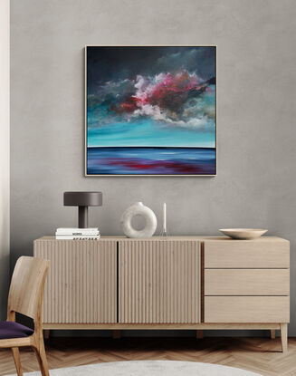 Textured moody cloudscape that looks like a storm is approaching with movement overlooking peaceful sea in rich teal and red tones.

